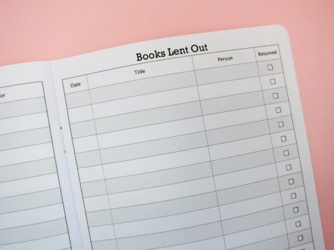 close up of books lent out in reading tracker notebook